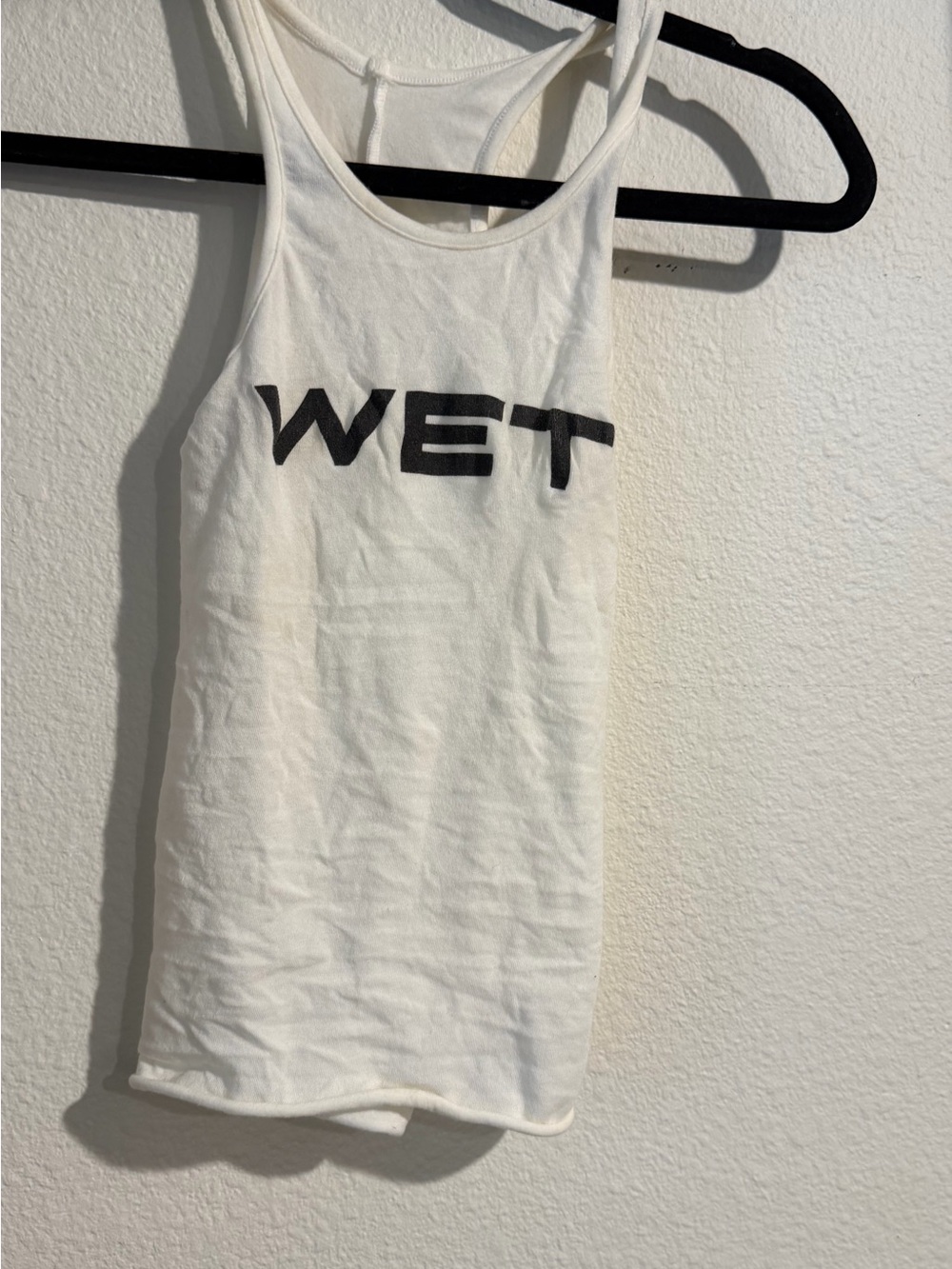 W E T shirt